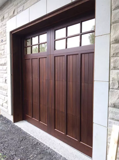 Wooden garage door with moulding and  windows, in real maple, Cedar colour, sold and installed by Portes Domac in Gatineau.